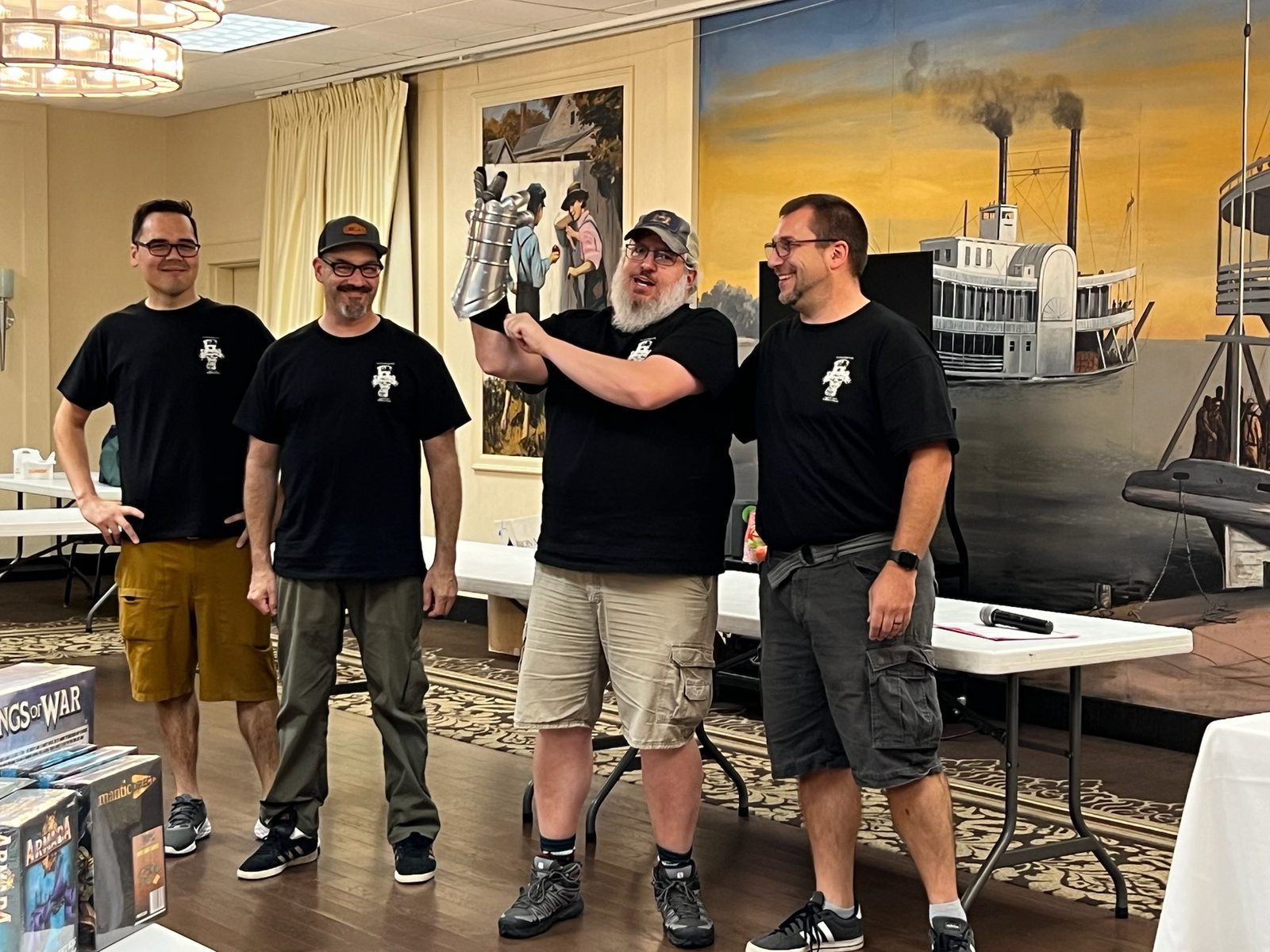 Group celebrating with trophies raised