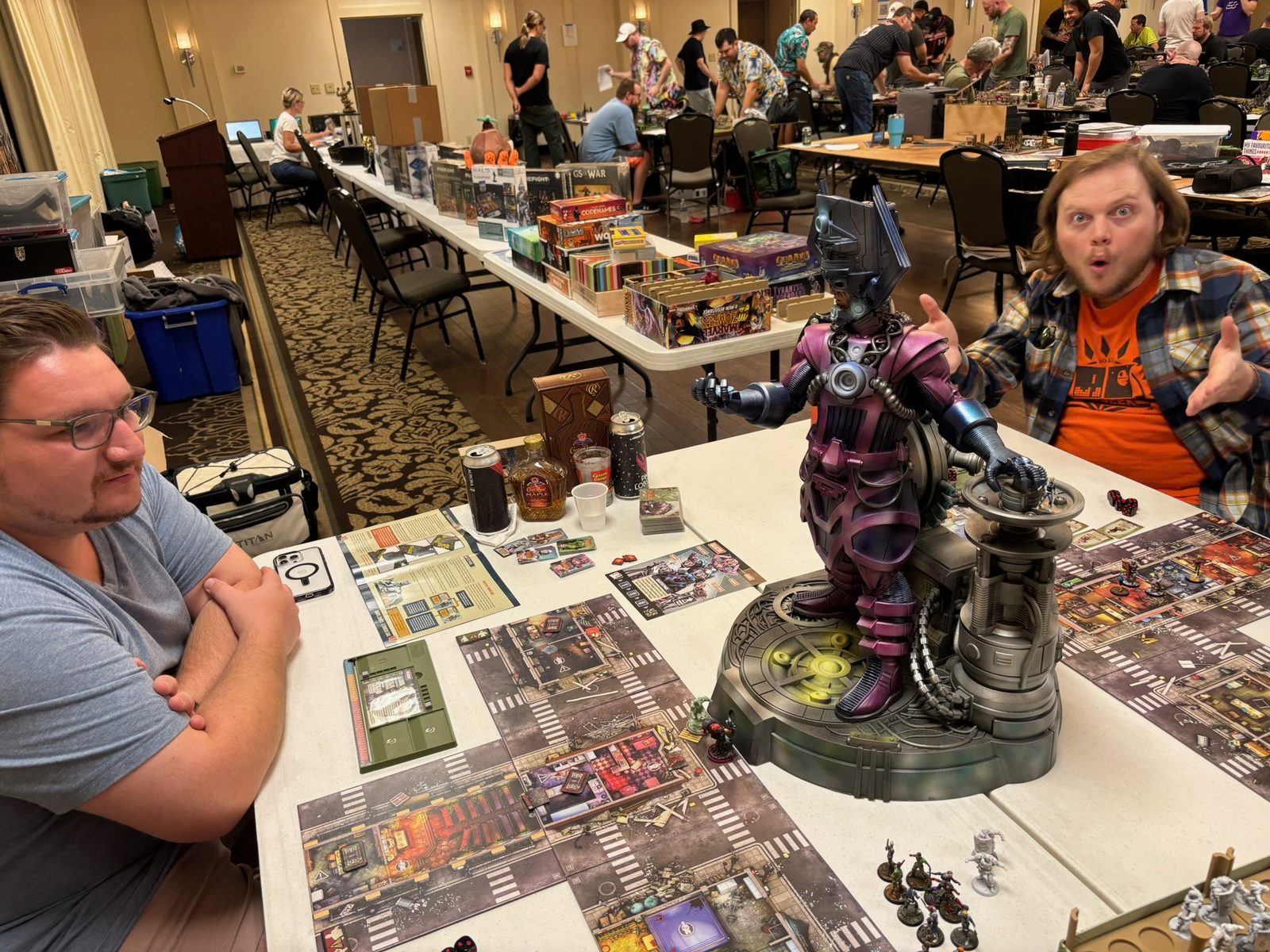 Tabletop game in progress with a large painted statue