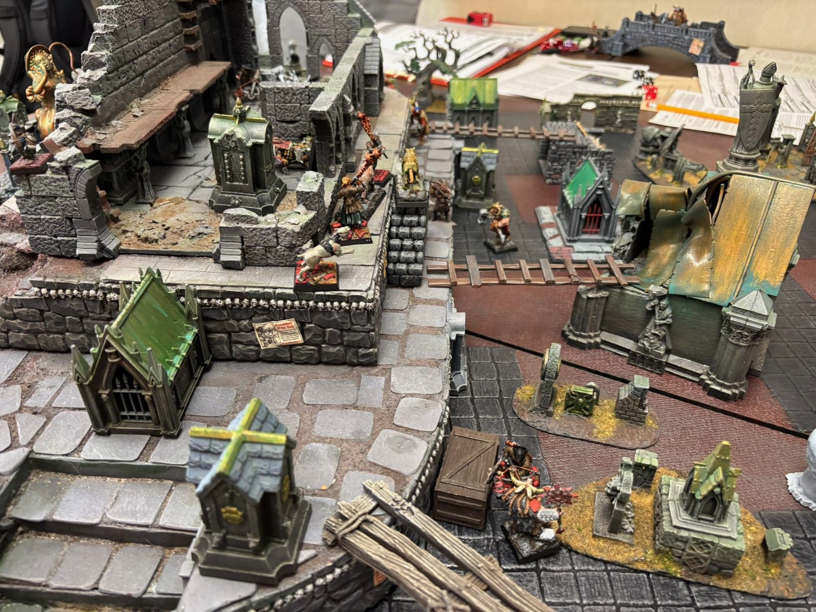 Ruined cathedral and graveyard terrain on the Mordheim table