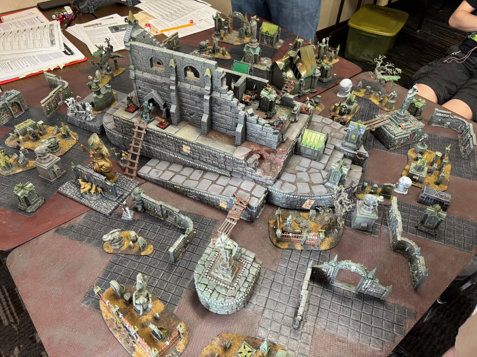 Overhead view of the ruined city terrain, bridge and statue